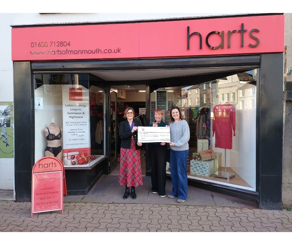 Photo of Monmouth Mayor Cllr Jackie Atkin presenting a cheque from the Mayor's Flood Recovery Fund to owners of Harts of Monmouth. Featured left to right: Monmouth Mayor Jackie Atkin, Harts owners Carol Davies and Carrie Francis.