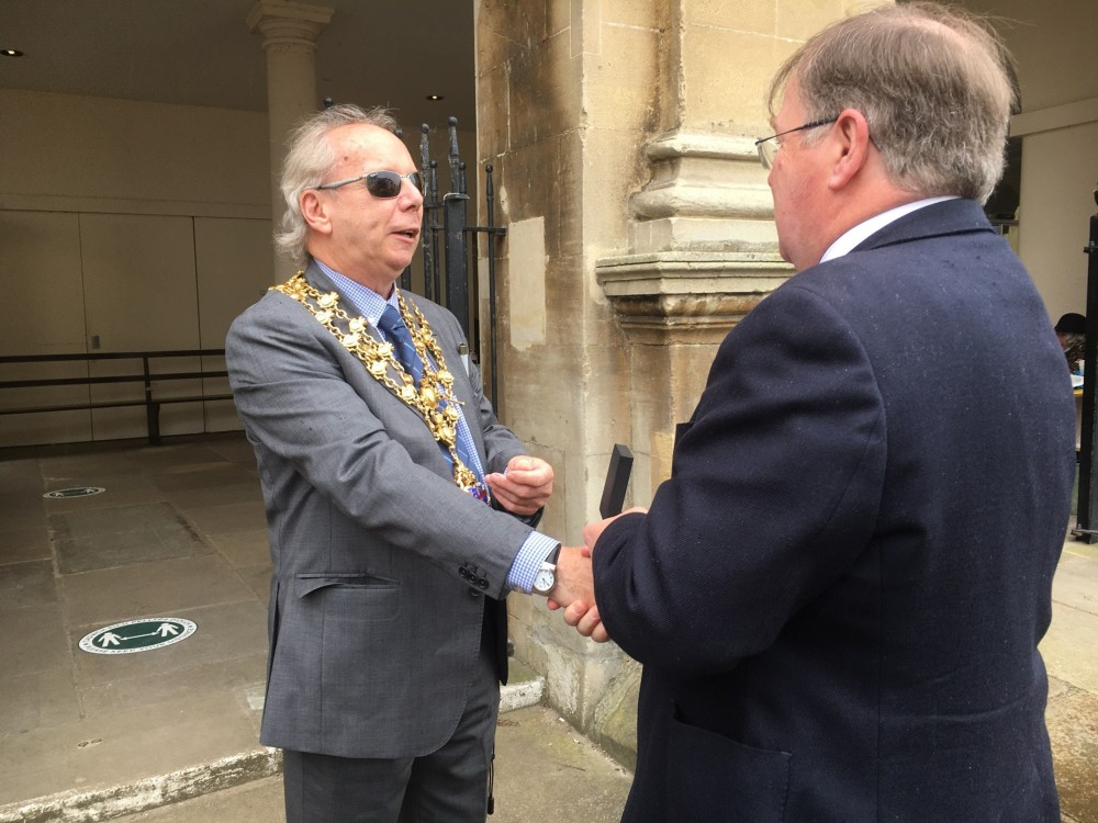 Cllr Christopher presenting the Past Mayor badge to Cllr Roden